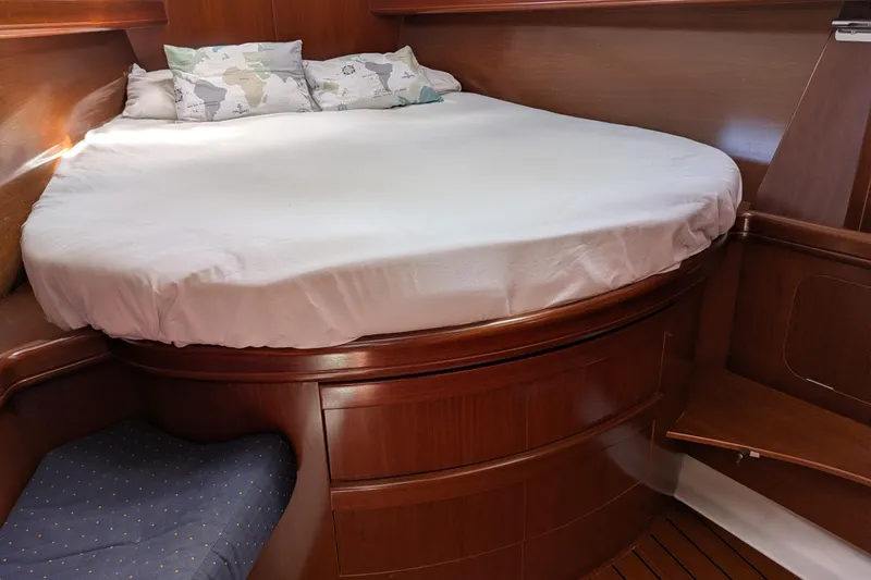 Laylay Yacht Photos Pics Cozy cabin interior of 2003 Beneteau Oceanis Clipper 473 with wooden furnishings.