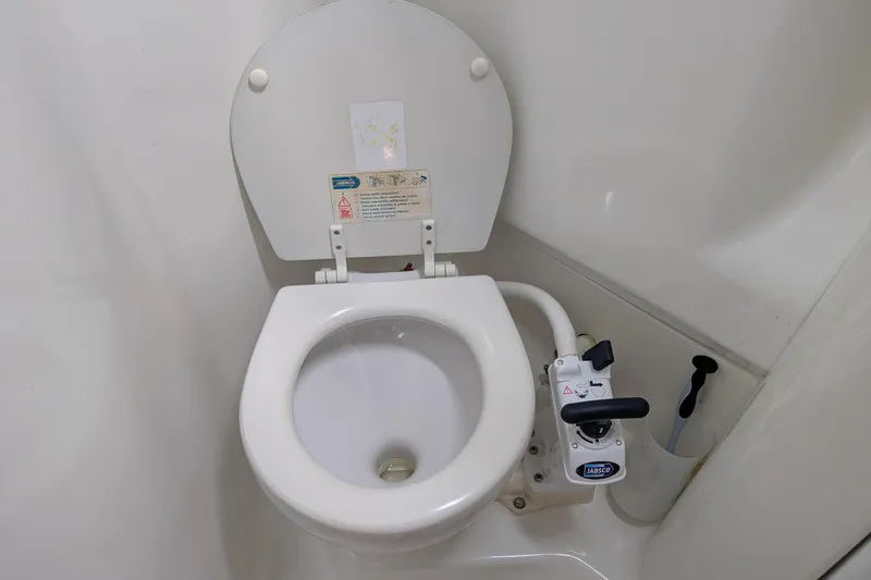 Laylay Yacht Photos Pics Marine toilet in 2003 Beneteau Oceanis Clipper 473 yacht bathroom.