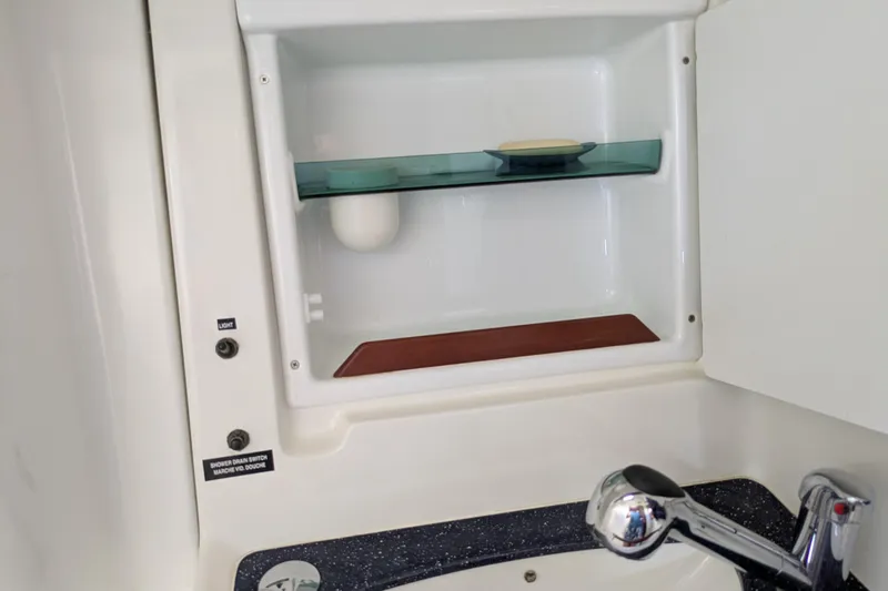 Laylay Yacht Photos Pics Beneteau Oceanis Clipper 473 bathroom with shelf and faucet, 2003 model.