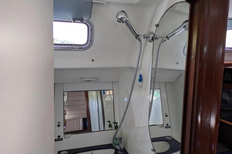 Laylay Yacht Photos Pics Interior of 2003 Beneteau Oceanis Clipper 473 yacht bathroom with shower and sink.