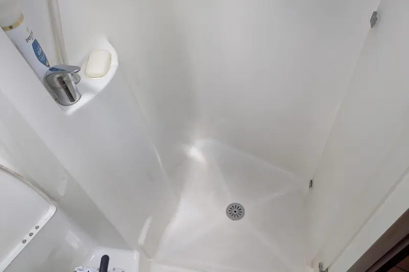 Laylay Yacht Photos Pics Shower area in 2003 Beneteau Oceanis Clipper 473 yacht, featuring soap and faucet.