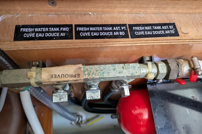 Laylay Yacht Photos Pics Fresh water tank labels and plumbing on 2003 Beneteau Oceanis Clipper 473 yacht.