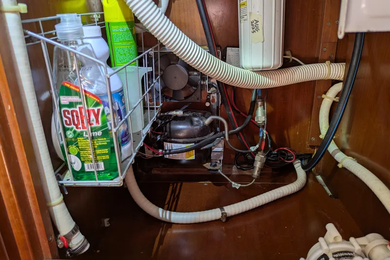 Laylay Yacht Photos Pics Interior of 2003 Beneteau Oceanis Clipper 473 showing storage and plumbing system.