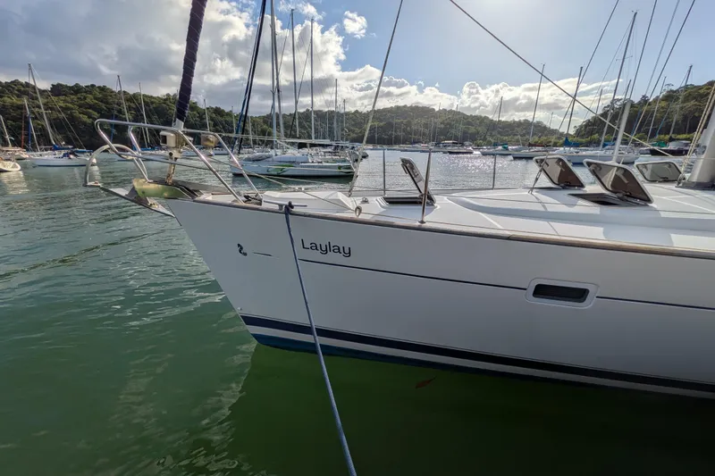 Laylay Yacht Photos Pics 2003 Beneteau Oceanis Clipper 473 sailboat docked in a scenic marina.