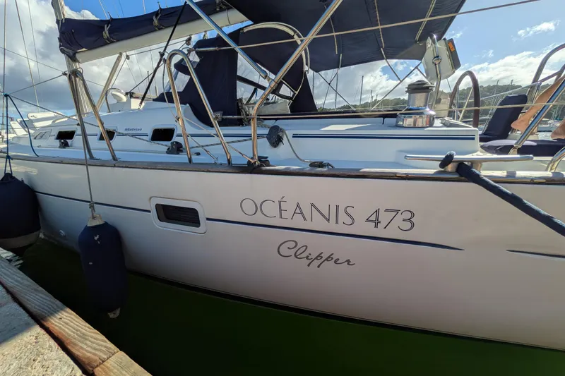 Laylay Yacht Photos Pics 2003 Beneteau Oceanis Clipper 473 sailboat docked at marina, side view.
