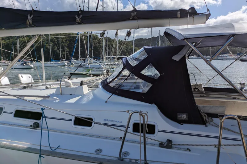 Laylay Yacht Photos Pics 2003 Beneteau Oceanis Clipper 473 sailboat docked in a marina, surrounded by other boats.