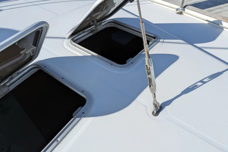 Laylay Yacht Photos Pics Open hatches on 2003 Beneteau Oceanis Clipper 473 deck, showcasing marine hardware.