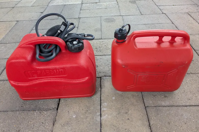 Laylay Yacht Photos Pics Red fuel containers on pavement, suitable for Beneteau Oceanis Clipper 473, 2003 model.