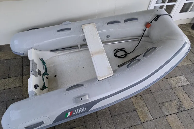 Laylay Yacht Photos Pics Inflatable dinghy on patio, associated with 2003 Beneteau Oceanis Clipper 473 yacht.