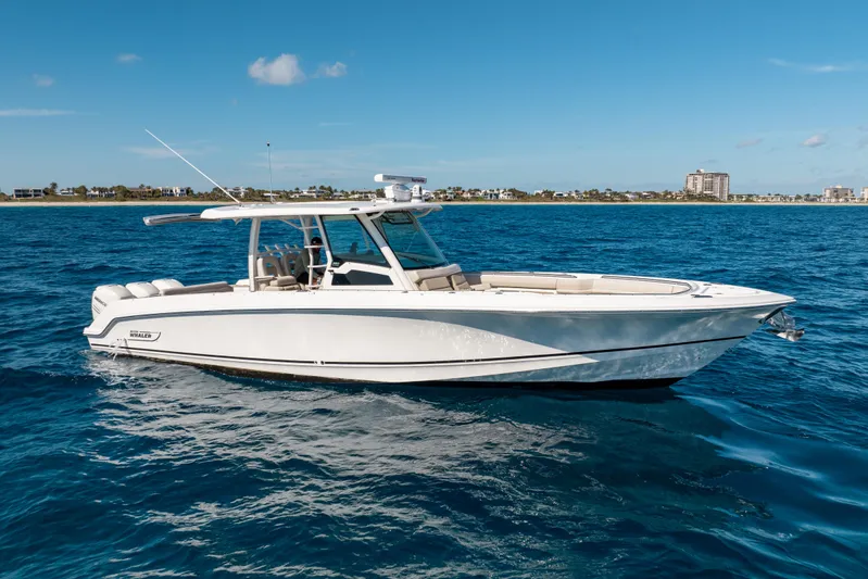  Yacht Photos Pics 2019 Boston Whaler 380 Outrage boat on calm blue ocean.