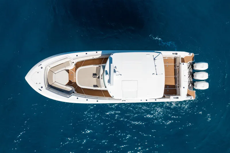  Yacht Photos Pics Aerial view of 2019 Boston Whaler 380 Outrage boat on blue water.