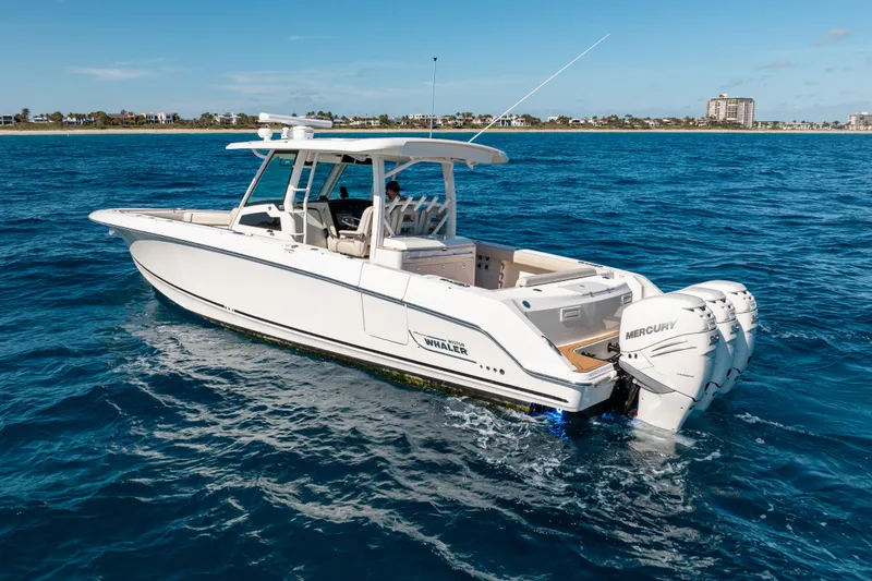  Yacht Photos Pics 2019 Boston Whaler 380 Outrage boat cruising on blue ocean waters.