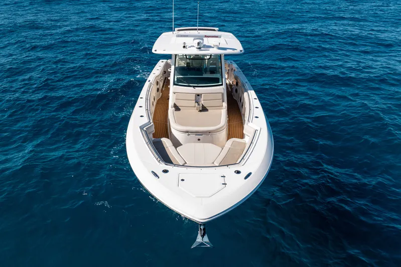  Yacht Photos Pics 2019 Boston Whaler 380 Outrage boat on open blue sea, aerial view.