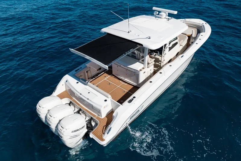  Yacht Photos Pics 2019 Boston Whaler 380 Outrage boat cruising on open blue water.