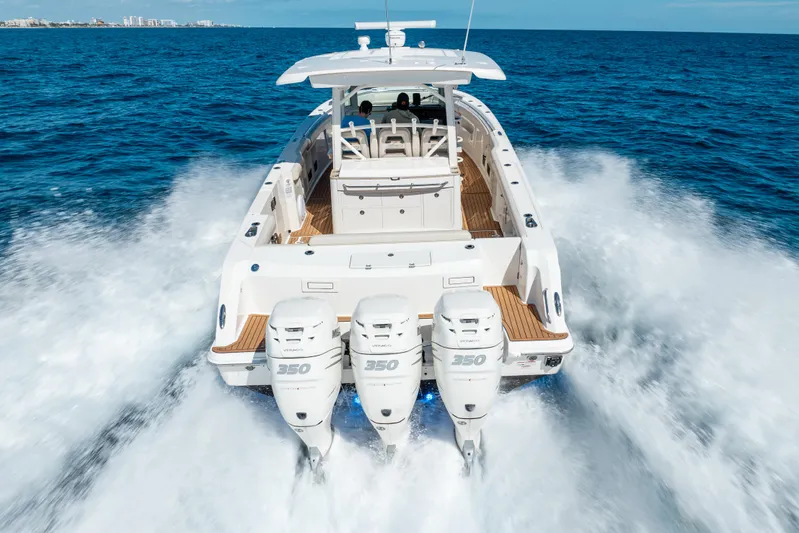  Yacht Photos Pics 2019 Boston Whaler 380 Outrage speeding on ocean with triple engines.