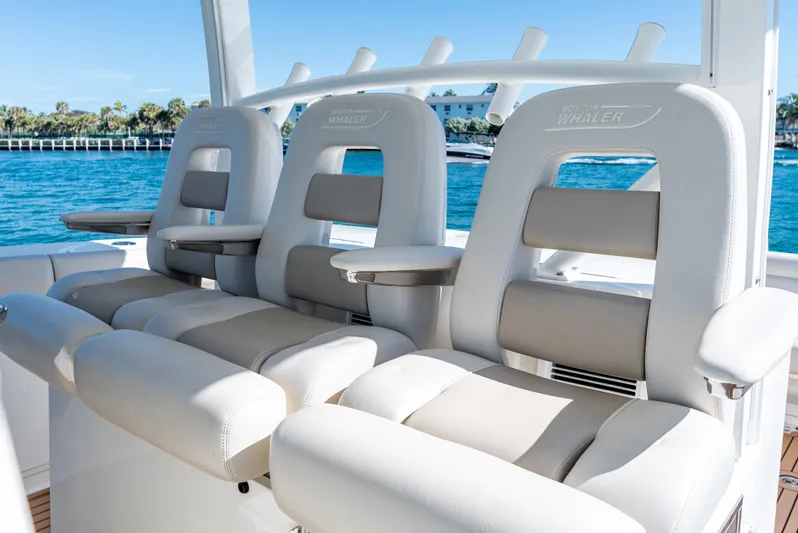  Yacht Photos Pics 2019 Boston Whaler 380 Outrage boat seats, luxurious white and gray design, ocean backdrop.