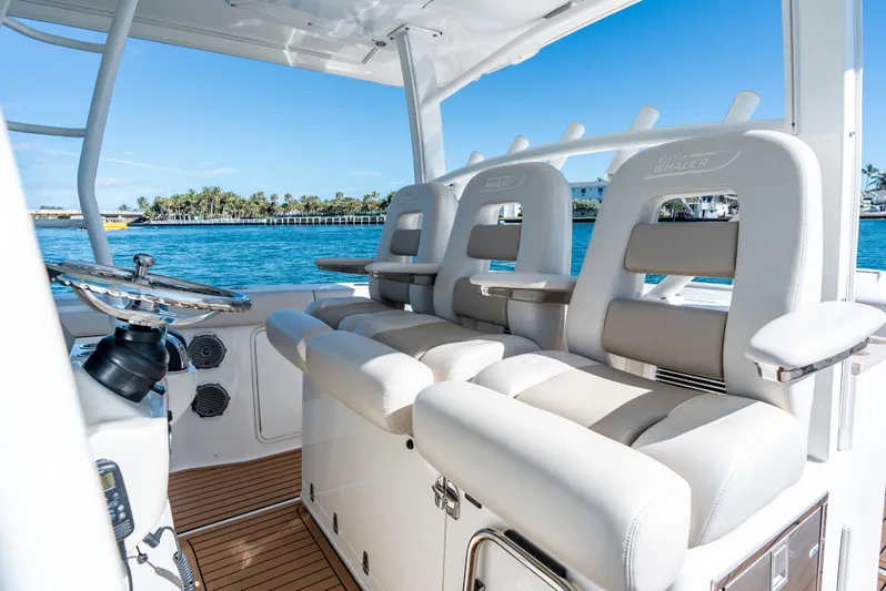  Yacht Photos Pics 2019 Boston Whaler 380 Outrage helm with luxurious seating and ocean view.