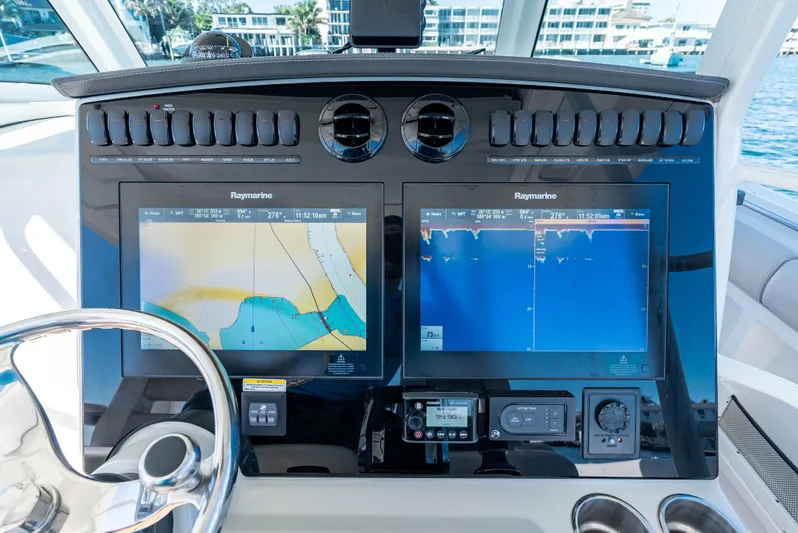  Yacht Photos Pics 2019 Boston Whaler 380 Outrage dashboard with dual Raymarine navigation screens.