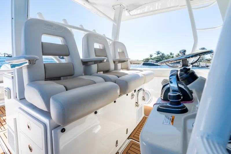  Yacht Photos Pics 2019 Boston Whaler 380 Outrage boat interior with plush seating and modern controls.
