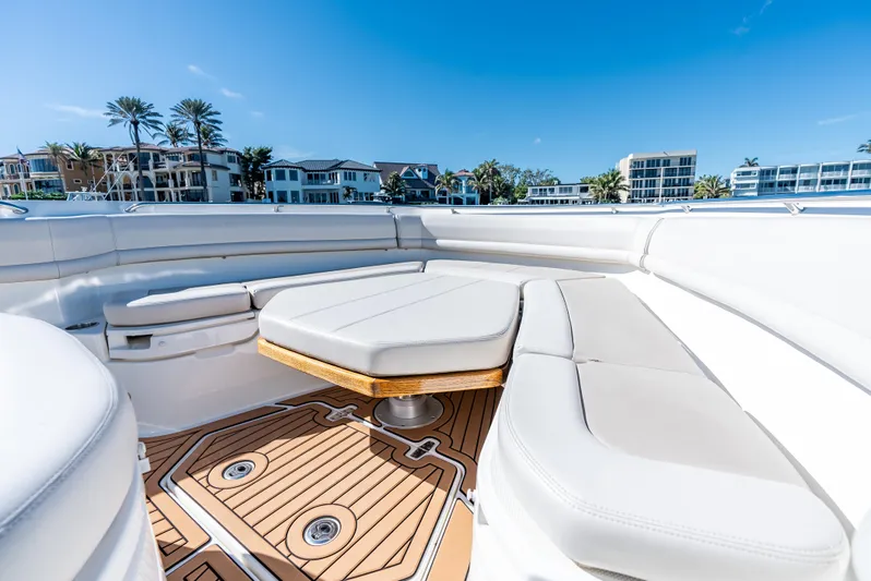  Yacht Photos Pics 2019 Boston Whaler 380 Outrage boat interior with luxurious seating and teak flooring.