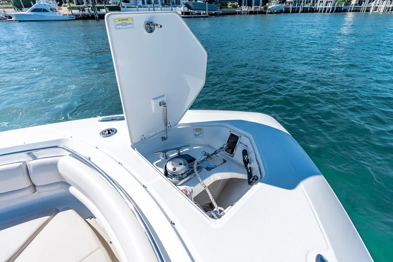  Yacht Photos Pics 2019 Boston Whaler 380 Outrage boat with open anchor locker on calm water.