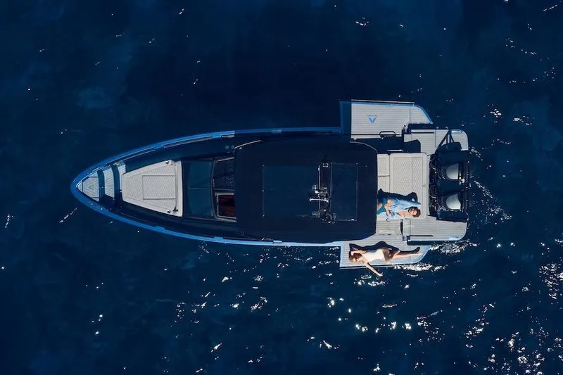  Yacht Photos Pics Aerial view of 2026 Virtue V10 T-Top boat on sparkling blue water.