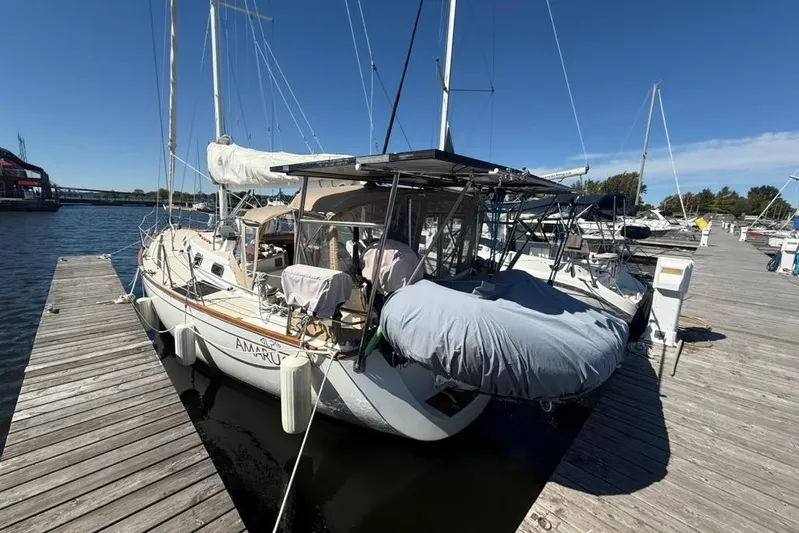  Yacht Photos Pics Sailboat docked at marina, Tartan 3500 model, 1998, under clear blue sky.
