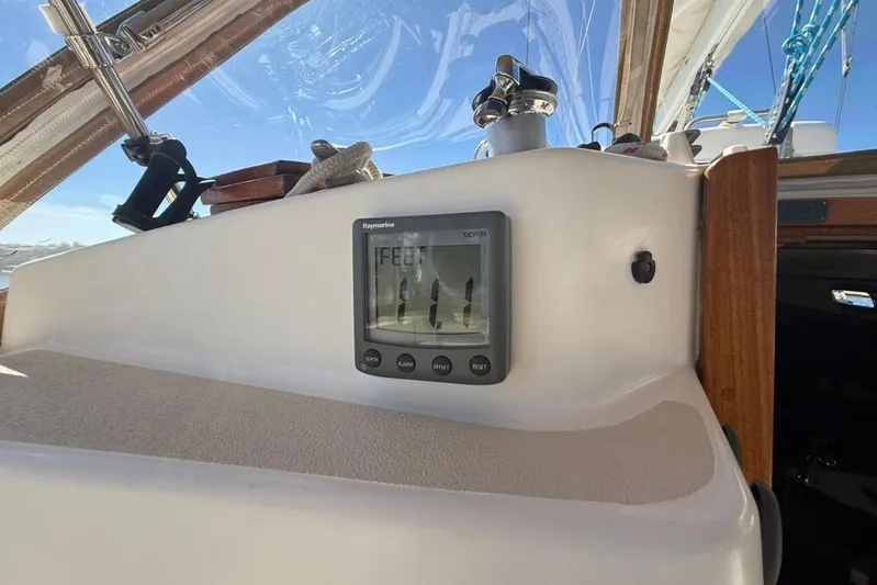  Yacht Photos Pics Depth gauge on 1998 Tartan 3500 sailboat dashboard under clear blue sky.