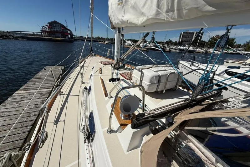  Yacht Photos Pics Sailboat docked at marina, Tartan 3500 model, 1998, with clear blue sky.