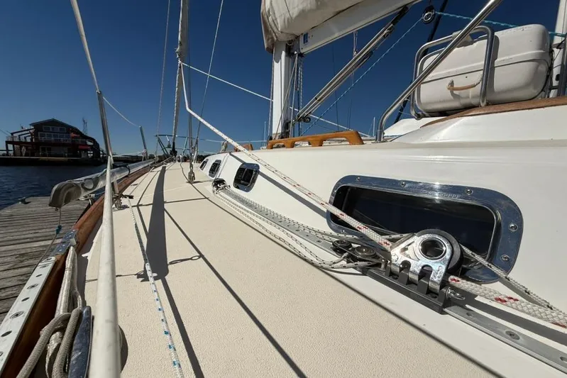  Yacht Photos Pics Deck view of a 1998 Tartan 3500 sailboat docked at a marina.
