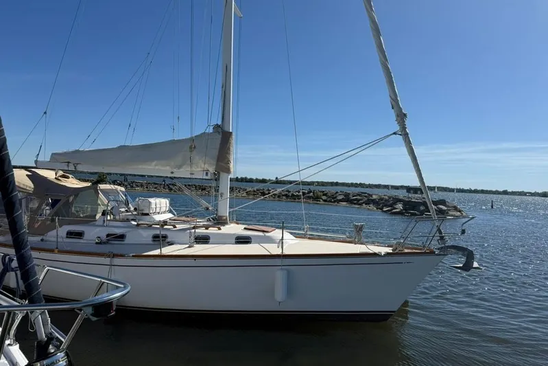  Yacht Photos Pics 1998 Tartan 3500 sailboat docked on a sunny day, with clear blue skies.