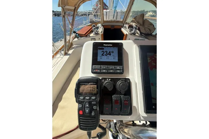  Yacht Photos Pics Cockpit of 1998 Tartan 3500 sailboat with navigation instruments and controls.