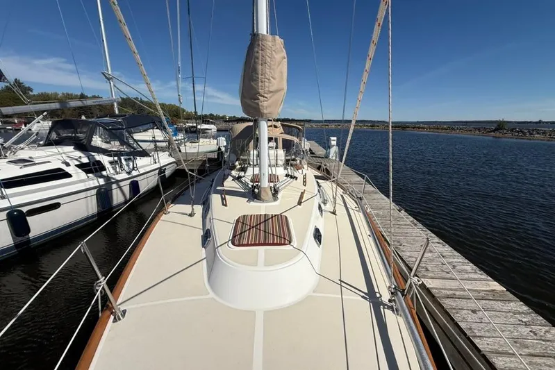  Yacht Photos Pics 1998 Tartan 3500 sailboat docked at marina under clear blue sky.