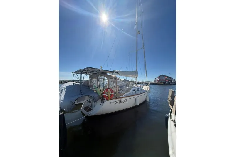  Yacht Photos Pics Sailboat docked under bright sun, 1998 Tartan 3500 model, marina background.