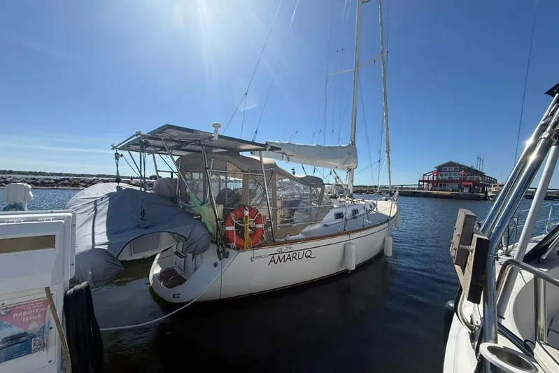  Yacht Photos Pics Sailboat Tartan 3500, 1998 model, docked at marina under clear blue sky.