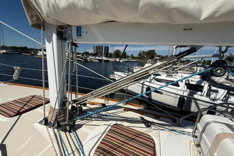  Yacht Photos Pics Sailboat deck view of 1998 Tartan 3500, featuring rigging and marina backdrop.