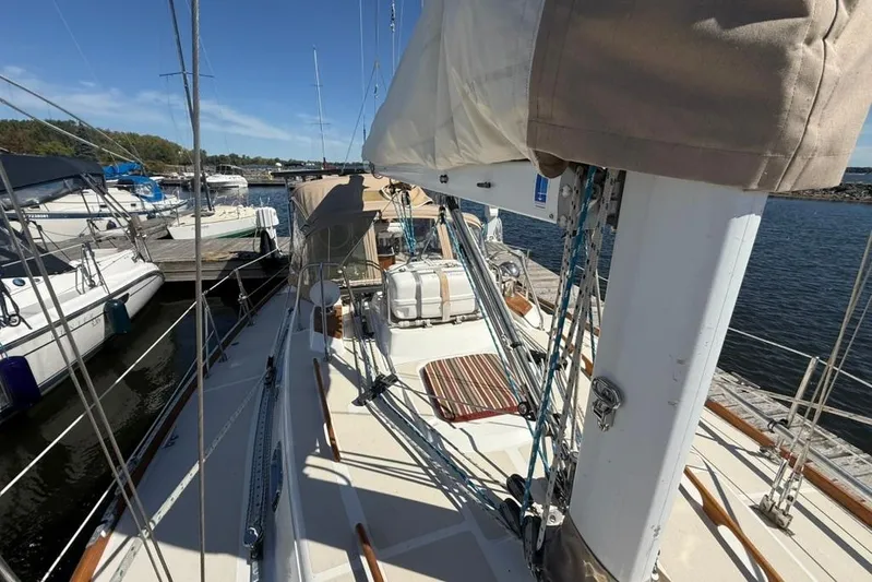  Yacht Photos Pics Sailboat docked at marina, Tartan 3500 model, 1998, with clear blue sky.