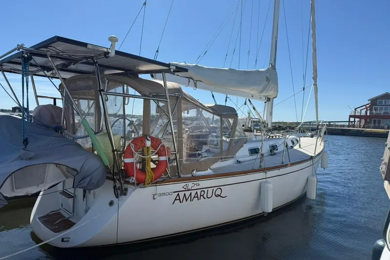  Yacht Photos Pics Sailboat Tartan 3500, 1998 model, docked in marina with clear blue sky.