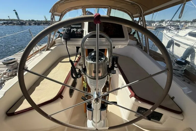  Yacht Photos Pics Cockpit of 1998 Tartan 3500 sailboat with steering wheel and navigation equipment.