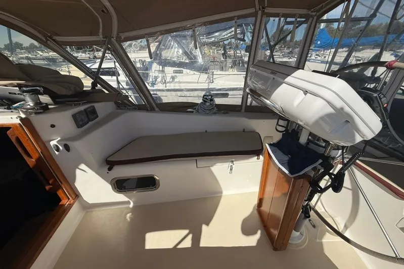 Yacht Photos Pics Interior of a 1998 Tartan 3500 sailboat cockpit with seating and navigation equipment.
