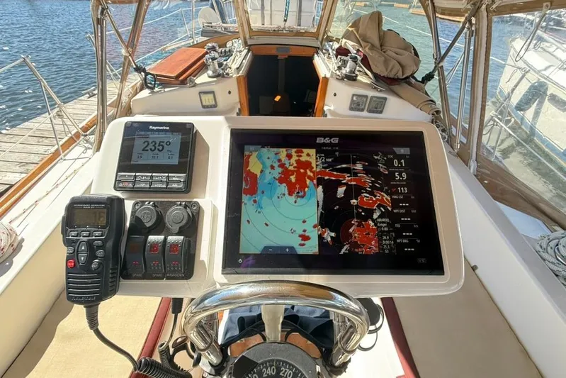  Yacht Photos Pics Cockpit of 1998 Tartan 3500 sailboat with navigation equipment and digital displays.