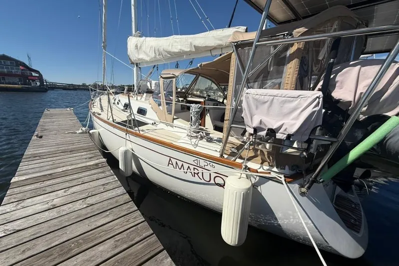  Yacht Photos Pics Sailboat docked at marina, Tartan 3500 model, 1998, with clear skies.