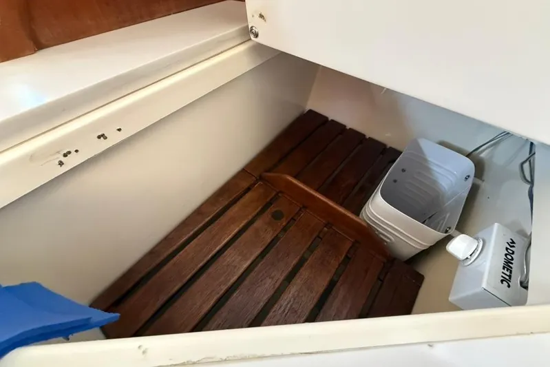  Yacht Photos Pics Interior of a 1998 Tartan 3500 sailboat with wooden flooring and Dometic equipment.