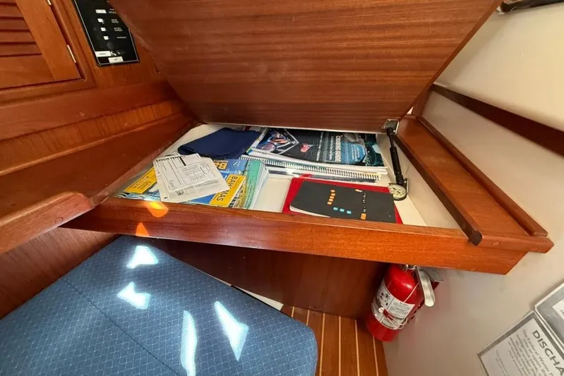  Yacht Photos Pics Nautical navigation station with charts and manuals on a Tartan 3500, 1998 model.