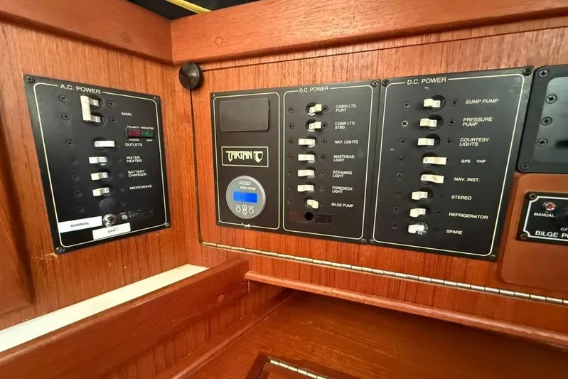  Yacht Photos Pics Electrical control panel on a 1998 Tartan 3500 yacht, featuring AC and DC power switches.