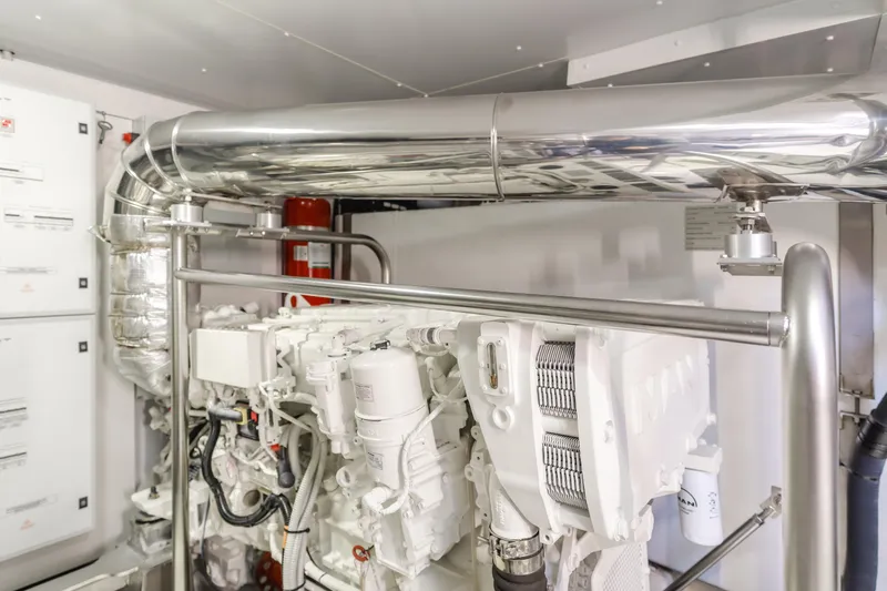 66 Magellano Yacht Photos Pics Engine room of 2023 Azimut Magellano 66 yacht, featuring advanced machinery and piping.