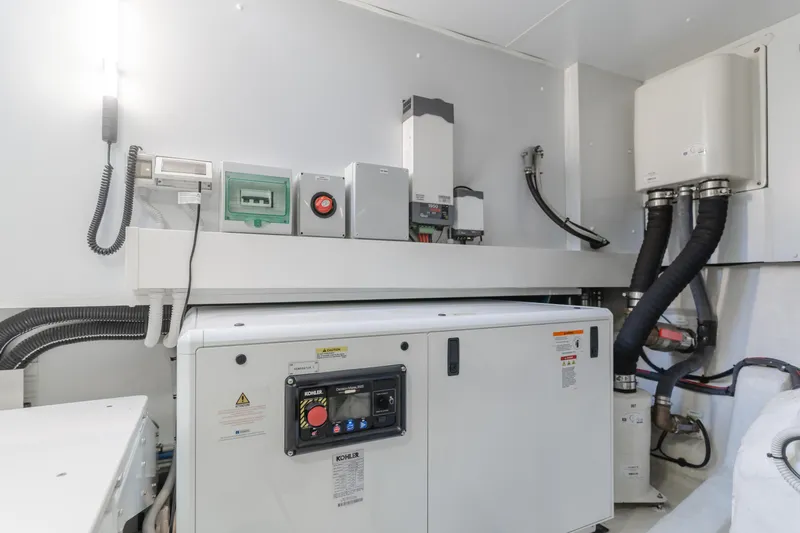 66 Magellano Yacht Photos Pics Engine room of 2023 Azimut Magellano 66 yacht with Kohler generator and electrical systems.