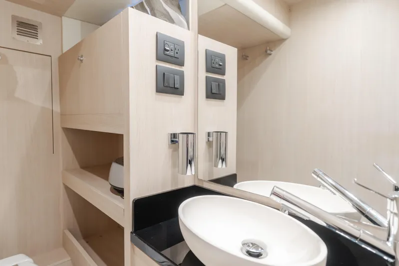66 Magellano Yacht Photos Pics Modern bathroom interior of 2023 Azimut Magellano 66 yacht with sleek fixtures.