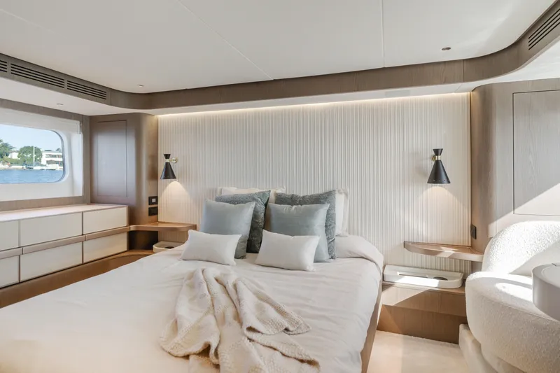 66 Magellano Yacht Photos Pics Luxurious bedroom interior of 2023 Azimut Magellano 66 yacht with modern design.