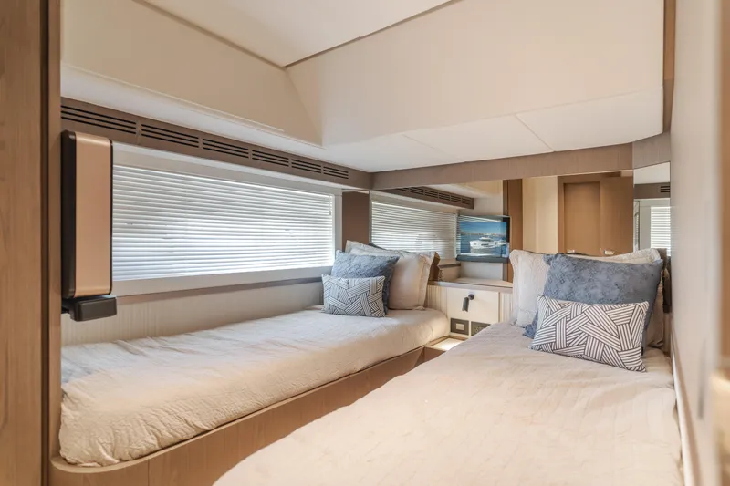 66 Magellano Yacht Photos Pics Luxurious twin cabin interior of 2023 Azimut Magellano 66 yacht, featuring modern design and comfort.